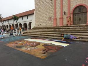 Jessea in front of the mission with her chalk drawing.